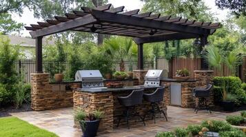 Outdoor kitchen featuring pergola, grill, and stonework in a backyard setting photo