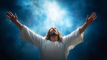 Spiritual figure with outstretched arms illuminated by divine light in a serene atmosphere photo