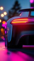 Luxury car illuminated by neon lights on a city street during twilight photo
