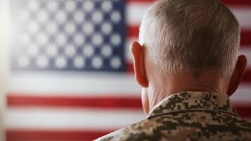 Veteran stands in front of American flag during solemn moment of reflection and honor for military service and sacrifice photo