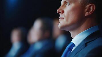 Business professionals attentively focus on a presentation during a conference held in a modern venue photo