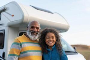 Grandfather and granddaughter enjoy a joyful moment outside their camper van during a sunny day in nature photo