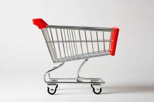 Shopping cart on a plain background, ready for grocery shopping or retail purchases photo