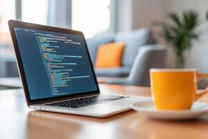 Programming on a laptop with vibrant coffee cup in a cozy modern workspace during the day photo