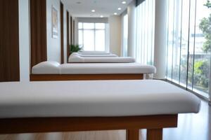 Spa therapy room featuring massage tables arranged for relaxation and wellness activities in a tranquil setting photo