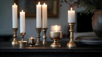 candles and a vase sit on a table with a vase and a candle photo