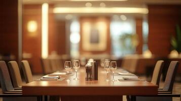 Blurred background of a boardroom table with chairs arranged around it photo