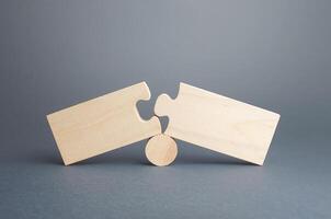 Two disassembled puzzles. Stop of work process and destruction of integrity due to obstacles or circumstances. Failure, inability to correct situation. Problem solving, finding the cause. Concept photo