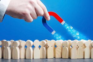 Hand with a magnet collects personal data from crowd figures online Internet users. Confidentiality protection of private information. Financial data leakage, password draining. Hackers photo