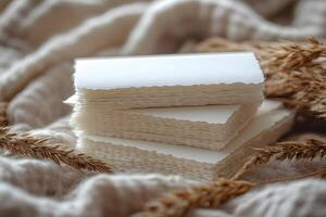 Rustic Blank Paper Stack on Linen with Dried Flowers for Creative Projects photo
