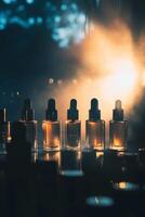 A row of small bottles of perfume are lined up on a table photo