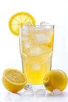 A glass of lemonade with ice cubes and a slice of lemon on the side photo
