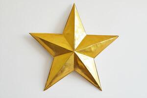 Shiny Golden Star on White Background photo