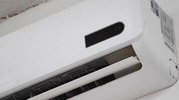 Turning On Air Conditioner, Adjusting Temperature on AC Unit, Beeping Sound from Remote Control, Modern Cooling System Operation, Energy Efficiency Demonstration video