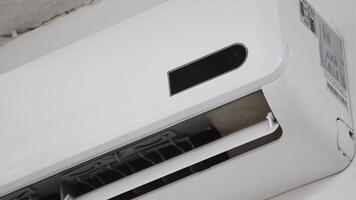Turning On Air Conditioner, Adjusting Temperature on AC Unit, Beeping Sound from Remote Control, Modern Cooling System Operation, Energy Efficiency Demonstration video