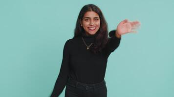 Woman showing inviting gesture with hands, ask to join beckoning to coming gesturing hello greetings video