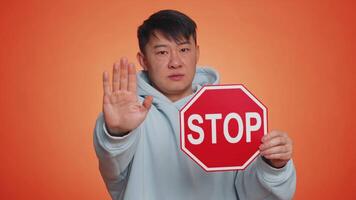 Man say no hold inscription text red No stop danger sign, warning of finish, prohibited access video