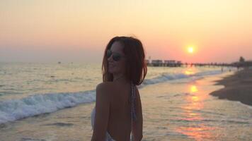 Girl Enjoying Sunset While Running Along the Beach in Golden Glow video