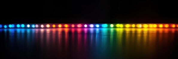 Vibrant rainbow led lights reflection on dark surface depicts colorful spectrum photo