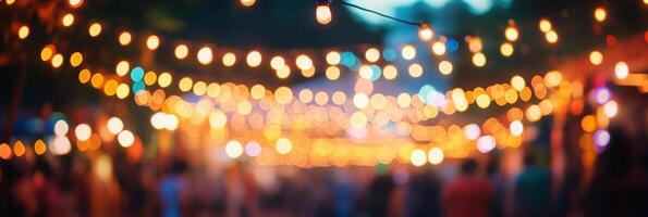 Festive string lights creating a warm atmosphere at outdoor evening celebration photo
