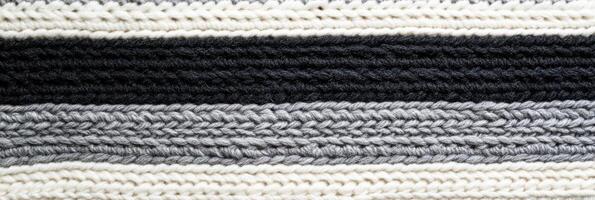 Black and white striped knitted textile pattern for background and textures photo