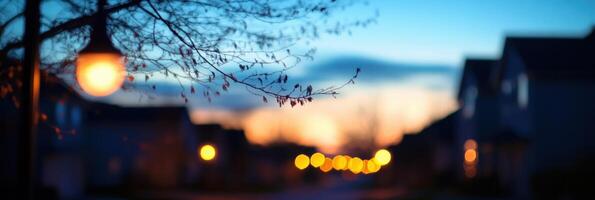 Tranquil suburban street at dusk with glowing streetlights and blurred background photo