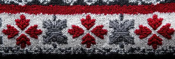 Knitted winter sweater pattern with red and gray snowflake design photo