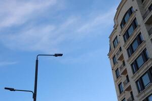 Modern architecture features artistic design set against a bright blue sky, creating allure photo
