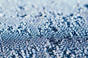 An Intricate CloseUp Study of the Unique and Detailed Texture Found in Denim Fabric Material photo