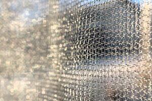 Protective mesh of the walls from a children's trampoline made of fabric durable synthetic mesh photo