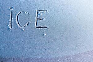 A Detailed CloseUp of Ice Texture Featuring the Engraved Word ICE within the Image photo