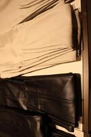 A Display of Fashionable Trousers Set in an Elegant and Stylish Retail Environment photo