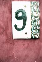 Introducing Stylish House Number 9, featuring a charming decorative background design photo
