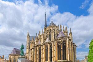 Amiens Cathedral Basilica of Our Lady Roman Catholic Church High Gothic architecture style building and Statue Peter the Hermit monument in old historical city centre, Hauts-de-France Region, France photo