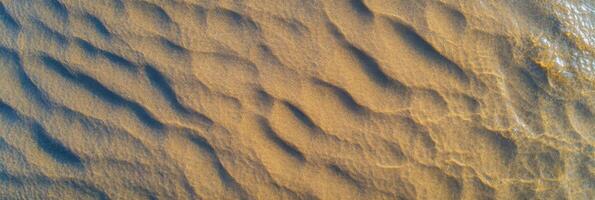 Aerial view of ripples in sand on a beach seashore texture pattern nature landscape photo