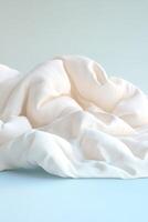 A soft glowing quilt rests on a surface, exuding warmth and comfort. The inviting textures symbolize stress relief, set against a soothing gradient background with space for text overlay photo