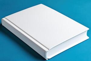 Minimalist design of a book with a blank white cover on a smooth gradient blue background for creative mockup purposes photo