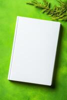 Minimalist book mockup with a blank cover on green background highlighting modern design aesthetics photo