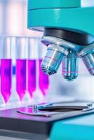 Close-up of a teal metallic microscope positioned on a black lab table with fuchsia DNA samples in the background for laboratory research photo