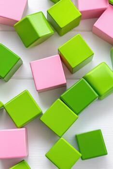 Brightly colored building blocks scattered on a white table create a cheerful and playful atmosphere for creative playtime photo