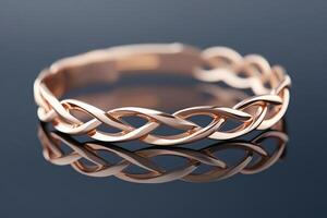 Futuristic rose gold bracelet showcasing a layered design with sleek, flowing elements against a deep black backdrop photo