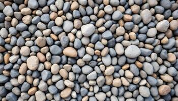Smooth stones of various neutral colors create a natural texture photo