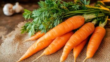 Bunch of Fresh Orange Carrots with Green Tops photo