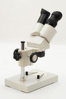Close-up of a scientific microscope showcasing precision instruments for detailed observation in laboratory photo