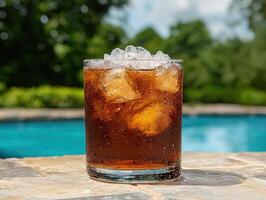 Refreshing iced drink by the pool on a summer day photo