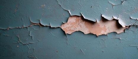Close up of peeling paint on a wall, showing texture and color variations photo