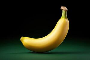 Single ripe yellow banana on a green background. photo