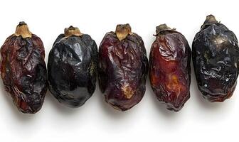 Five Dried Dates Arranged in a Row photo