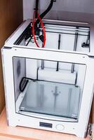 3d printer with bright red filament. photo