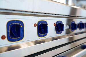 Cooking controls display with numbered dials in a modern kitchen setting during food preparation photo